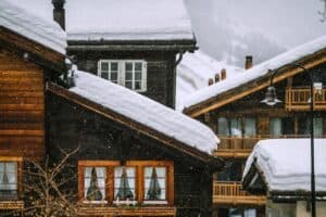 Wooden houses covered in snow